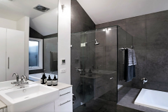 Charcoal feature tile with large mirror & sink