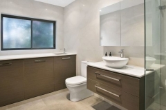 Combined Ensuite & Laundry with custom cabinets